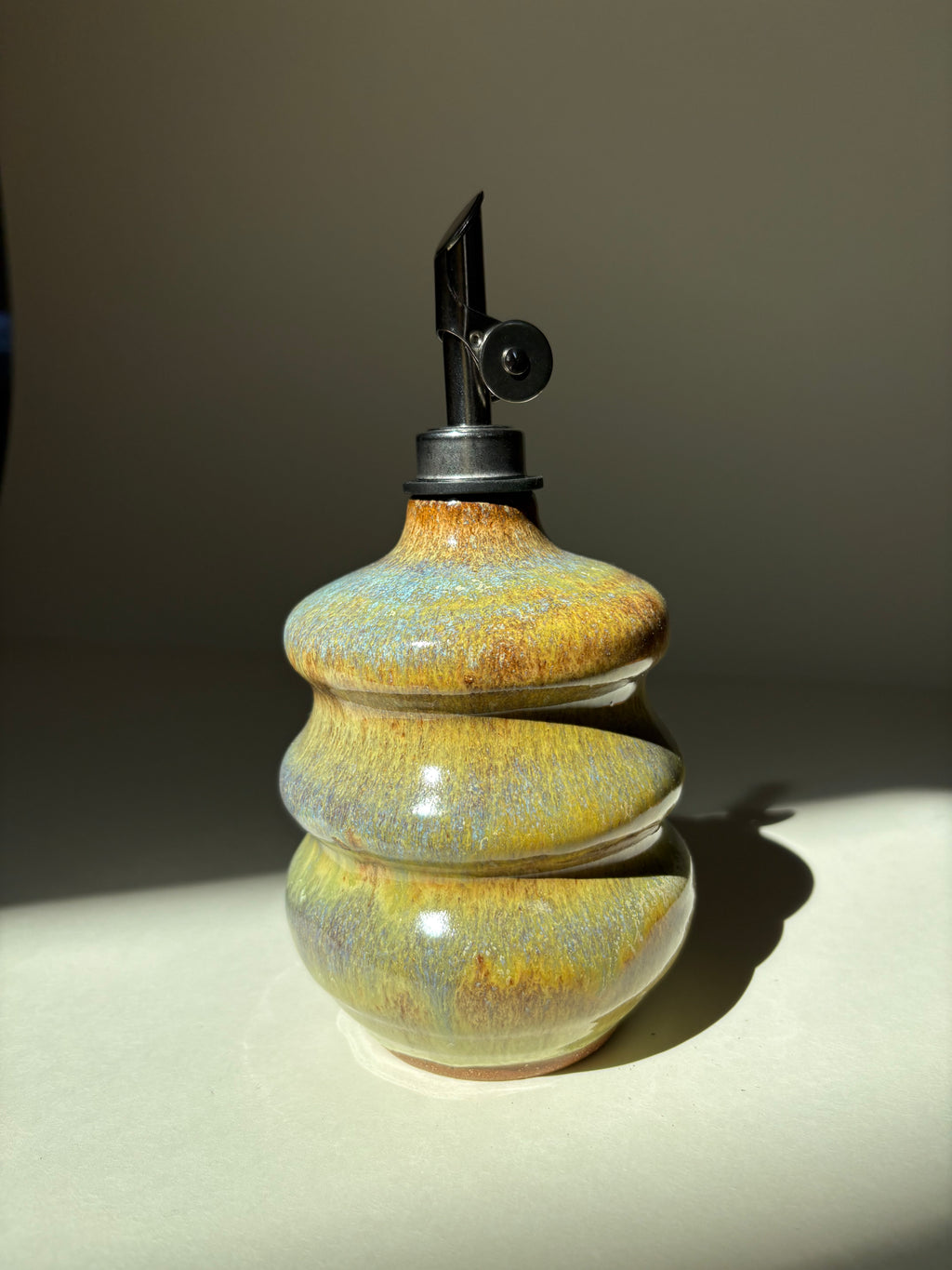 Green and blue oil dispenser - 21